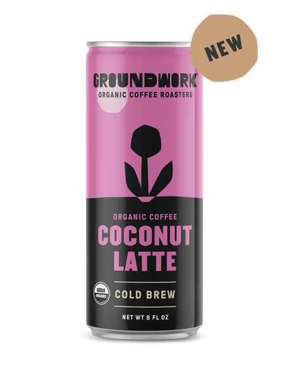 A can of Groundwork Coffee Organic Cold Brew Latte with a pink and black label and a NEW badge in the top right corner.