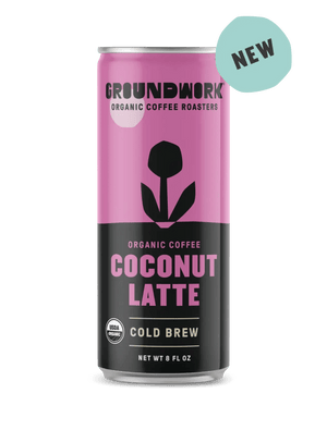 A can of Groundwork Coffee Organic Cold Brew Latte with a pink and black design and a "NEW" label in the top right corner.