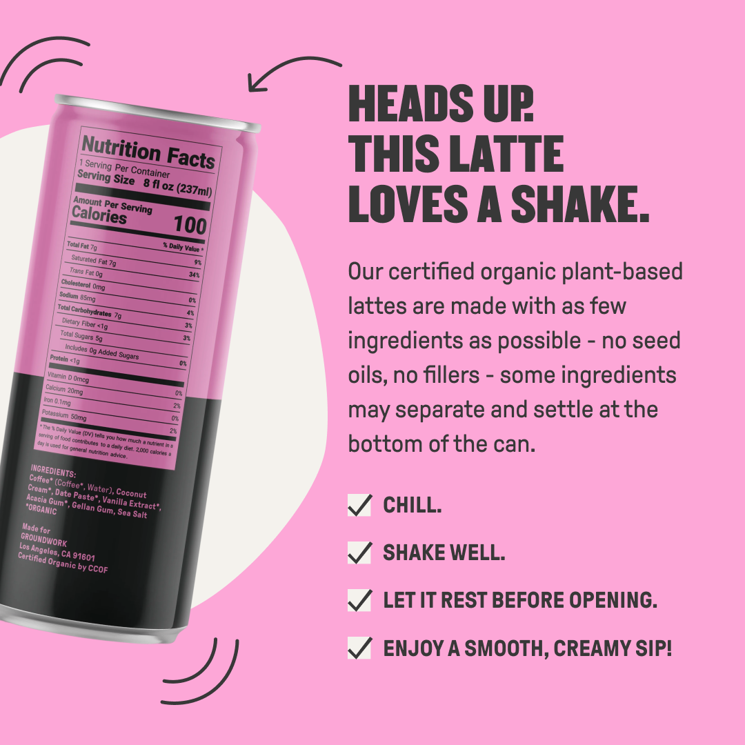 A pink can of Groundwork Coffee Organic Cold Brew Latte, plant-based and low sugar, is tilted on pink. Shake well, let rest, and enjoy a smooth, creamy sip.