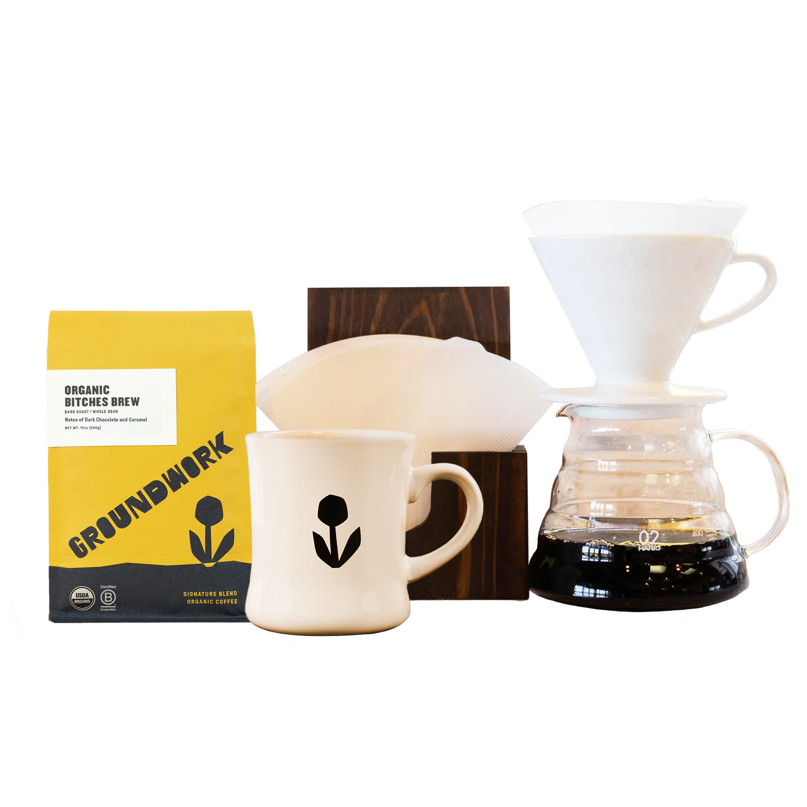 The Hario V60 Pro Bundle from Groundwork Coffee includes a bag of coffee, a white ceramic mug, and filters—ideal for the perfect pour-over experience.