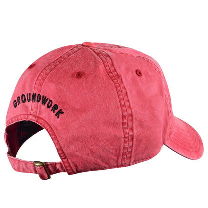 The Whole Being Dad Hat by Groundwork Coffee, shown from the back, features black “GROUNDWORK” embroidery and an adjustable strap with metal clasp.