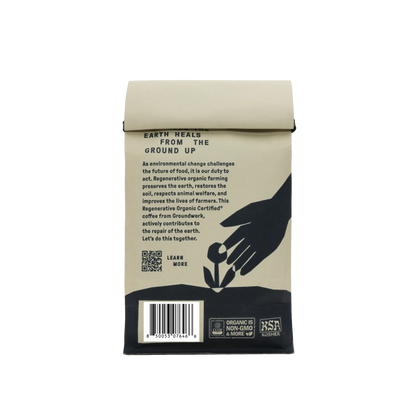 Groundwork Coffee Store’s Regenerative Organic Certified® Good Vibrations features a hand planting seedling, notes of apricot/citrus, and organic, non-GMO, and kosher logos at the bottom.