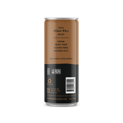 A brown and black can of Groundwork Coffee Organic Cold Brew Latte labeled vegan, dairy-free, gluten-free, no seed oils, with instructions to chill and shake well.