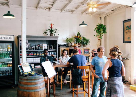 Inside of Groundwork cafe, customers talking amongst each other