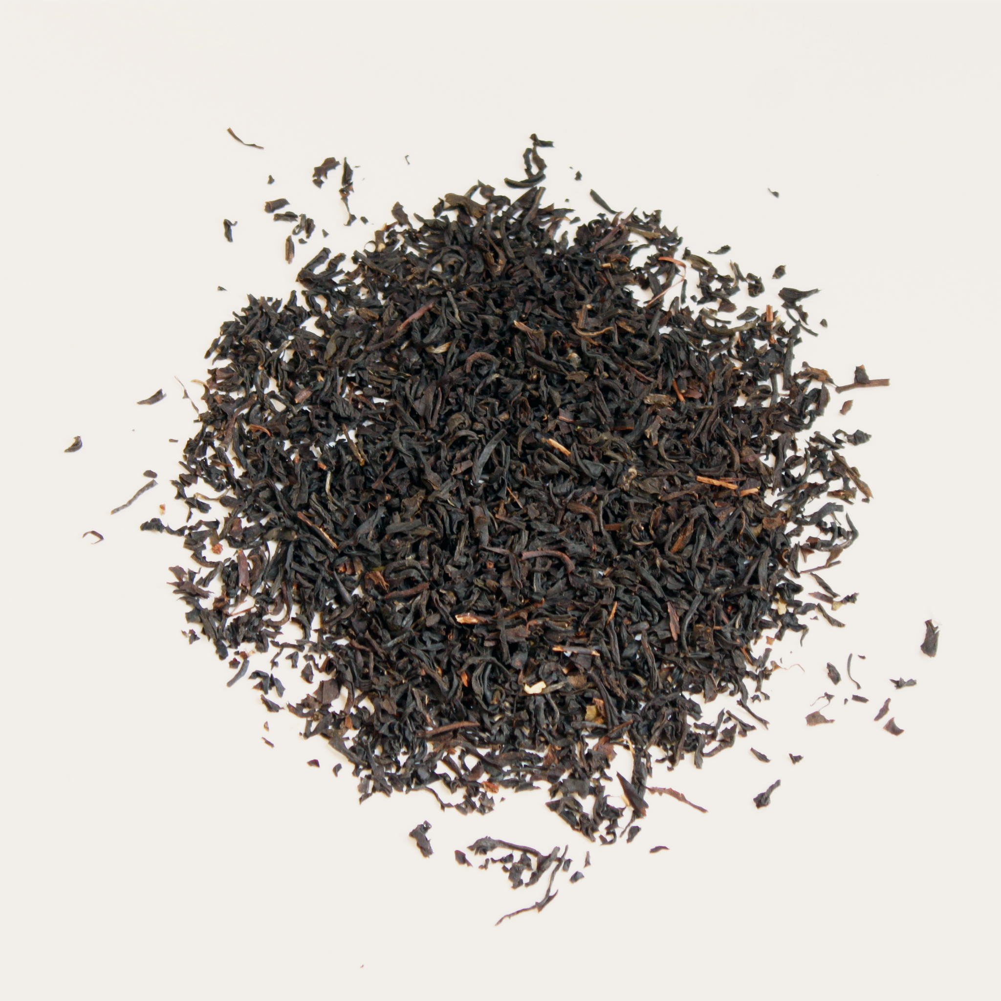 pile of loose leaf organic assam tea 