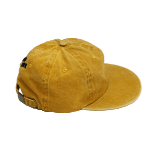 Side view of Groundwork unstructured 6-panel cotton hat in marigold. Adjustable closure on back 